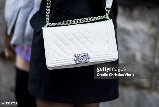 White Chanel bag outside Marc Jacobs on February 16, 2017 in New York City.