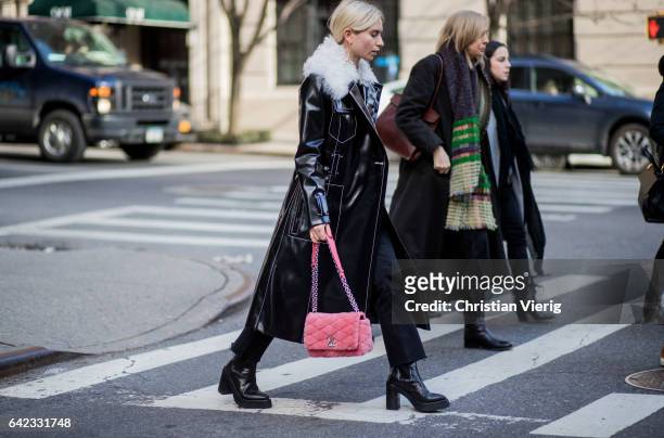 Courtney Trop wearing a black coat, Chanel bag outside Marc Jacobs on February 16, 2017 in New York City.