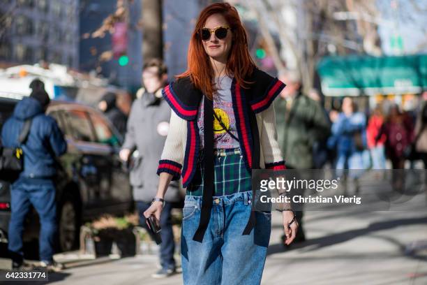 Taylor Tomasi Hill wearing denim jeans outside Marc Jacobs on February 16, 2017 in New York City.