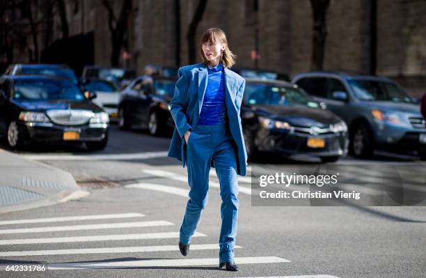 Anya Ziourova wearing a blue suit, velvet knit outside Marc Jacobs on February 16, 2017 in New York City.