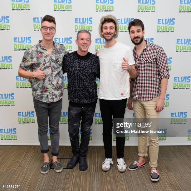 Ryan Met, Elvis Duran, Jack Met and Adam Met pose together for a photo during the band AJR's visit at "The Elvis Duran Z100 Morning Show" at Elvis...