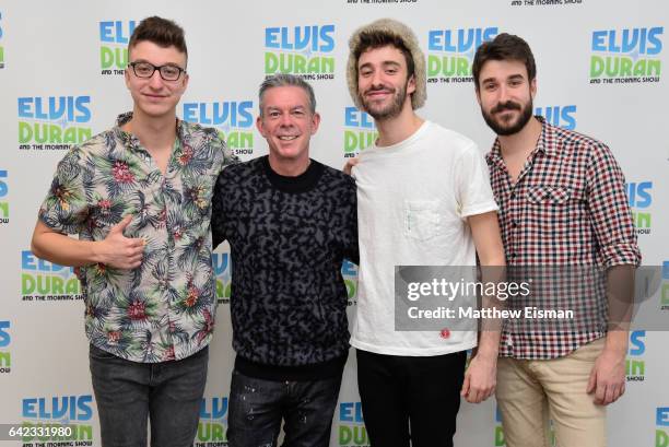 Ryan Met, Elvis Duran, Jack Met and Adam Met pose together for a photo during the band AJR's visit at "The Elvis Duran Z100 Morning Show" at Elvis...