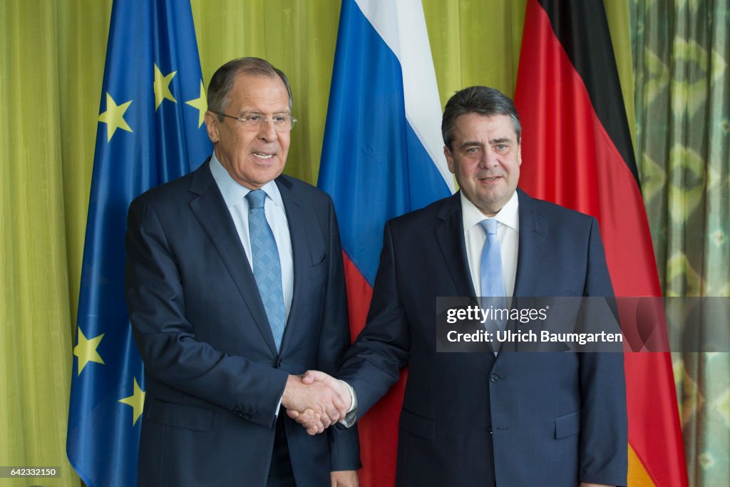 G20 Foreign Ministers Meeting in Bonn. Sergey Lavrov, Russian Foreign Minister (L) and Federal Foreign Minister Sigma Gabriel at the welcome. Flags of the EU, Russia and Germany.