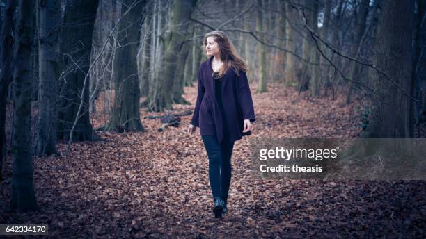 beautiful young woman in the woods - theasis stock pictures, royalty-free photos & images