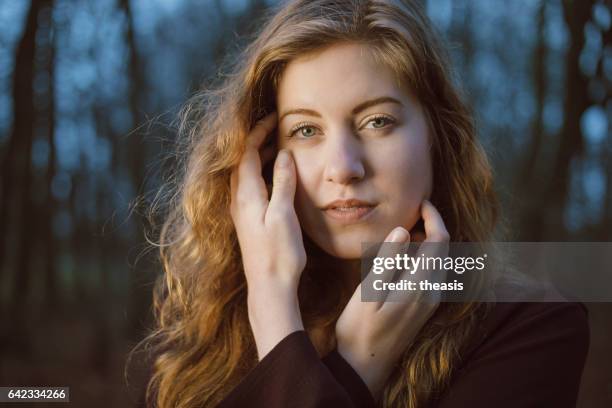 beautiful young woman in the woods - theasis stock pictures, royalty-free photos & images