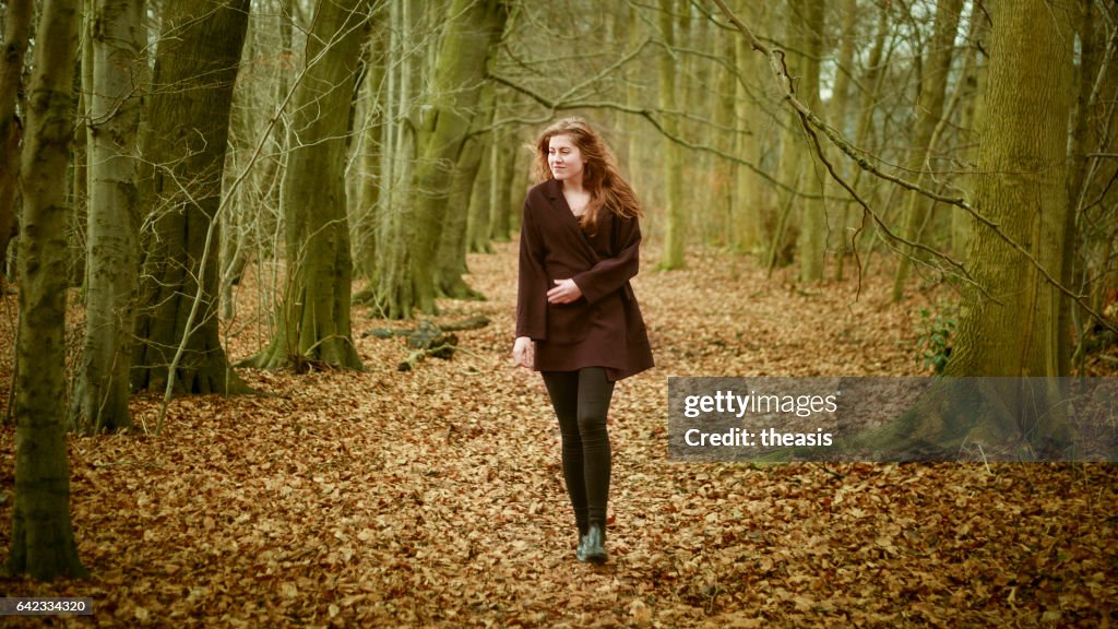 Beautiful young woman in the woods