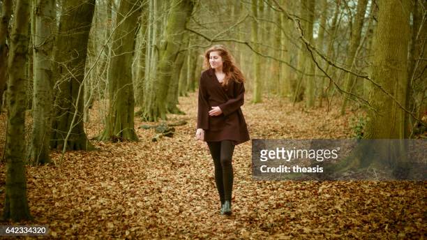beautiful young woman in the woods - theasis stock pictures, royalty-free photos & images
