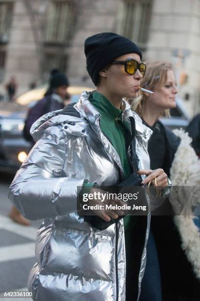 Adwoa Aboah wears a silver puffer jacket after the Marc Jacobs show on February 17, 2017 in New York City.