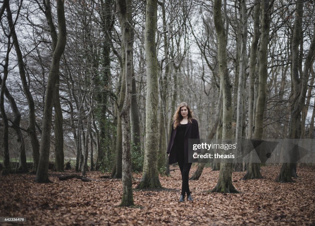 Beautiful young woman in the woods