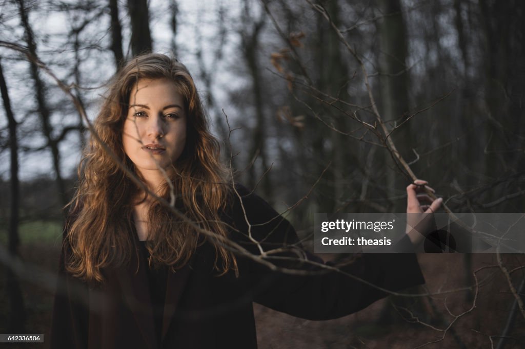 Beautiful young woman in the woods