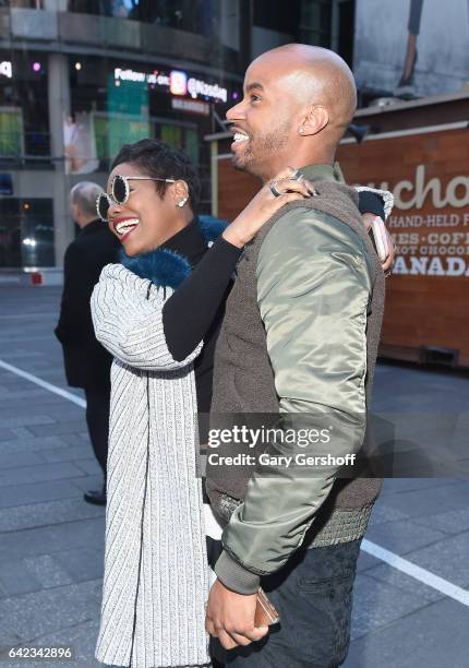 Cast members Afton Williamson and Antoine Harris of VH1's "The Breaks" seen in Times Square after attending the NASDAQ opening bell at NASDAQ on...