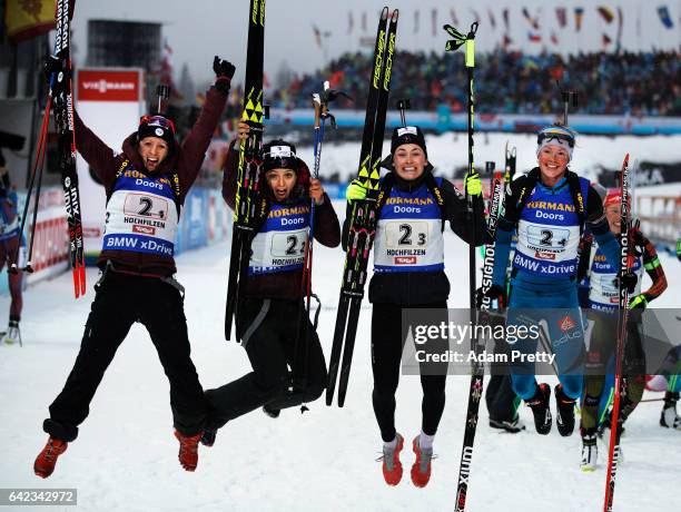 Anais Chevalier, Celia Aymonier, Justine Braisaz and Marie Dorin Habert of France celebrate winning the Bronze medal in the Women's 4x 6km relay...