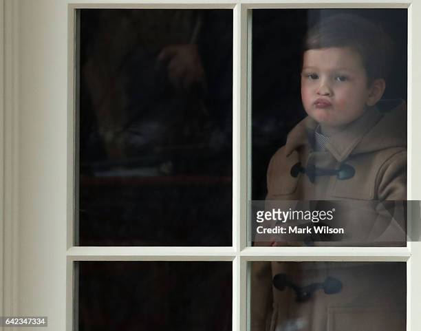 Three year old Joseph Kushner pushes his nose against a window in the Oval Office while waiting to depart with his grandfather U.S. President Donald...