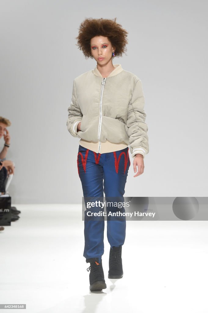 A model walks the runway at the Ru runway at Fashion Scout during the ...