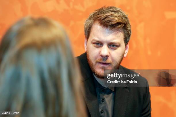 Director Marvin Kren discuss with host Caro Matzko during the Berlinale Open House Panel '4 Blocks' at Audi Berlinale Lounge on February 17, 2017 in...