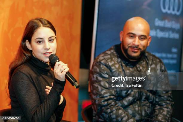 Actress Almila Bagriacik and rapper and actor Veysel Gelin discuss with host Caro Matzko during the Berlinale Open House Panel '4 Blocks' at Audi...