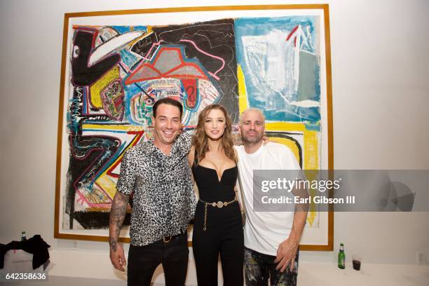 Michael Konior, Alyssa Arce and artist Danny Mannick attend the Power To The Planet Exhibition Opening at De Re Gallery on February 16, 2017 in West...