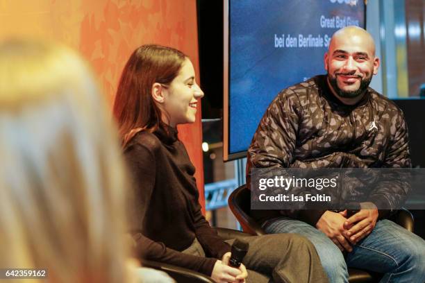 Actress Almila Bagriacik and rapper and actor Veysel Gelin discuss with host Caro Matzko during the Berlinale Open House Panel '4 Blocks' at Audi...