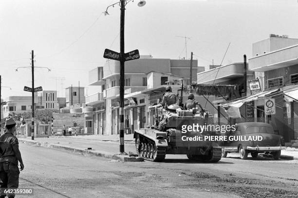 An Israeli tank patrols in a street in June 1967 in Jerusalem during the 1967 Arab-Israeli war. On 05 June 1967, Israel launched preemptive attacks...