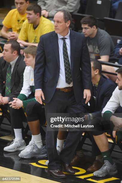 Head coach John Becker of the Vermont Catamounts looks on during a college basketball game against the UMBC Retrievers at the RAC Arena on February...