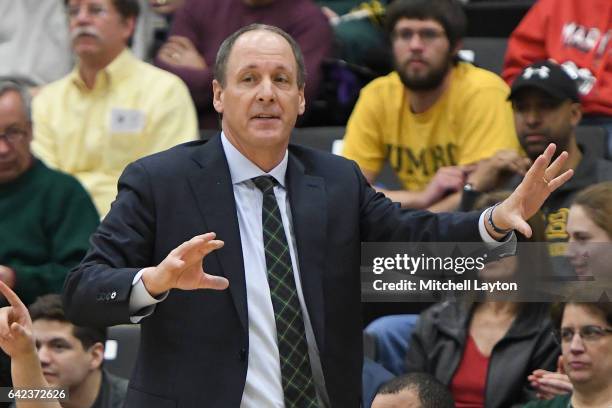 Head coach John Becker of the Vermont Catamounts looks on during a college basketball game against the UMBC Retrievers at the RAC Arena on February...