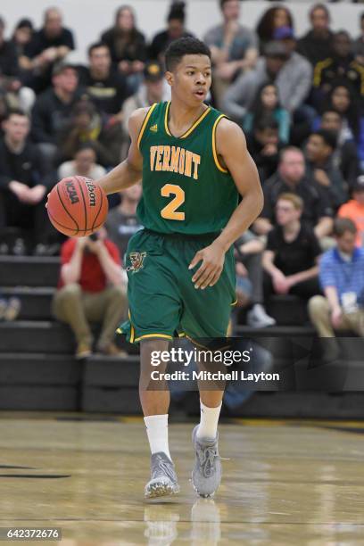 Trae Bell-Haynes of the Vermont Catamounts dribbles up court during a college basketball game against the UMBC Retrievers at the RAC Arena on...