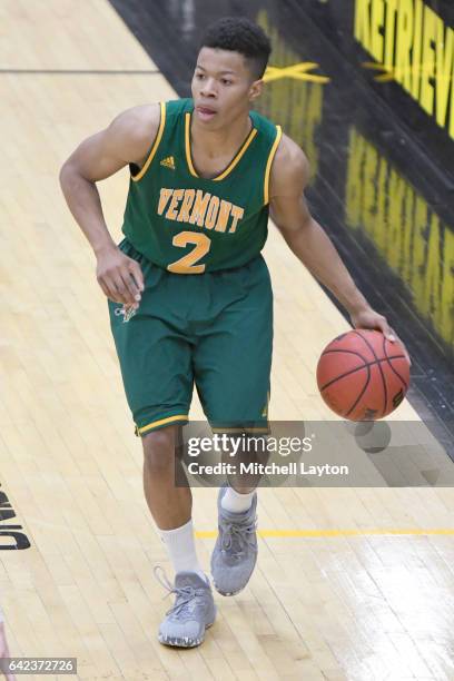 Trae Bell-Haynes of the Vermont Catamounts dribbles the ball during a college basketball game against the UMBC Retrievers at the RAC Arena on...