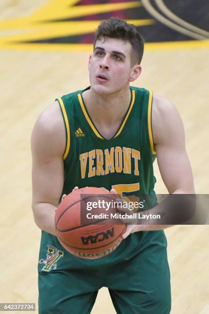 Payton Henson of the Vermont Catamounts takes a foul shot during a college basketball game against the UMBC Retrievers at the RAC Arena on February...