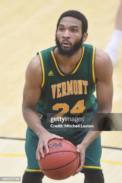 Dre Wills of the Vermont Catamounts takes a foul shot during a college basketball game against the UMBC Retrievers at the RAC Arena on February 12,...