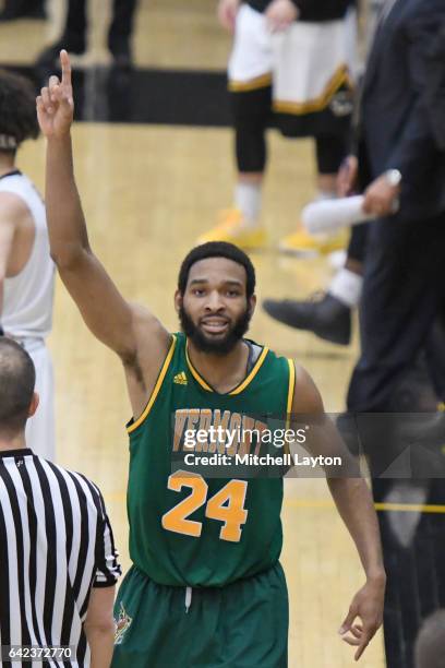 Dre Wills of the Vermont Catamounts celebrates a win after a college basketball game against the UMBC Retrievers at the RAC Arena on February 12,...