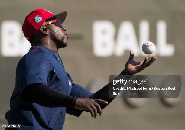 Rusney Castillo of the Boston Red Sox catches a ball bare-handed during drills on February 17, 2017 at jetBlue Park in Fort Myers, Florida. Rusney...