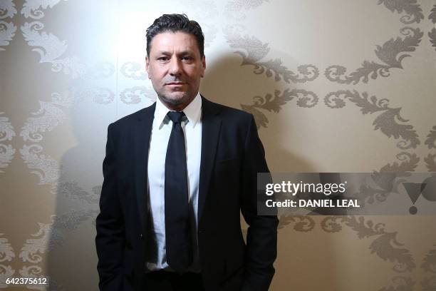 Filippo Scuffi, DAKS creative director poses backstage before a DAKS catwalk show on the first day of the Autumn/Winter 2017 London Fashion Week in...