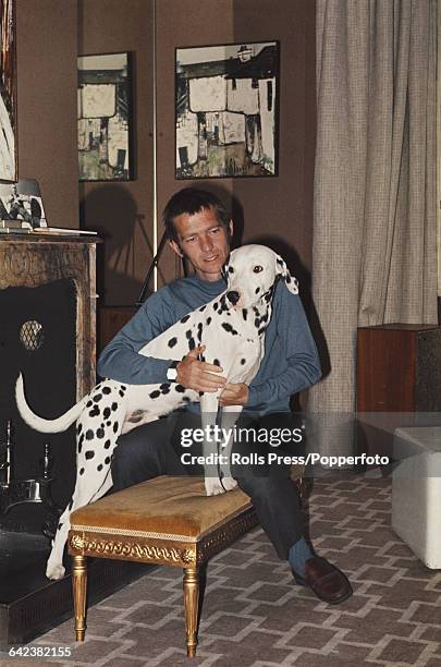 English actor Tom Courtenay, who plays the role of Ivan Denisovich in the film 'One Day in the Life of Ivan Denisovich', pictured with his Dalmatian...