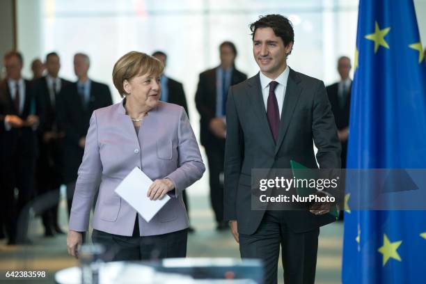 German Chancellor Angela Merkel and Canada's Prime Minister Justin Trudeau arrive to a news conference at the Chancellery in Berlin, Germany on...