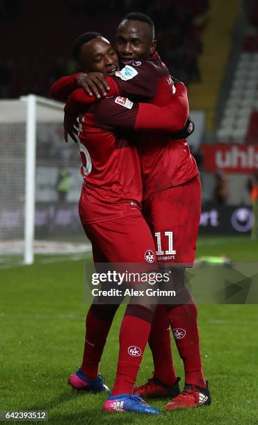 Osayamen Osawe of Kaiserslautern celebrates scoring the third goal with Jacques Zoua Daogari during the Second Bundesliga match between 1. FC...