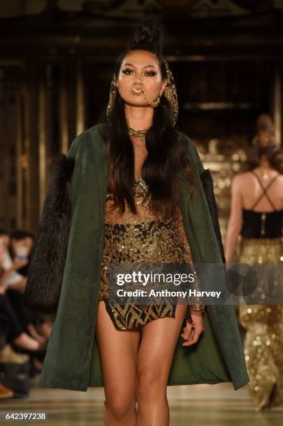 Model walks the runway at the Limkokwing University show at Fashion Scout during the London Fashion Week February 2017 collections on February 17,...