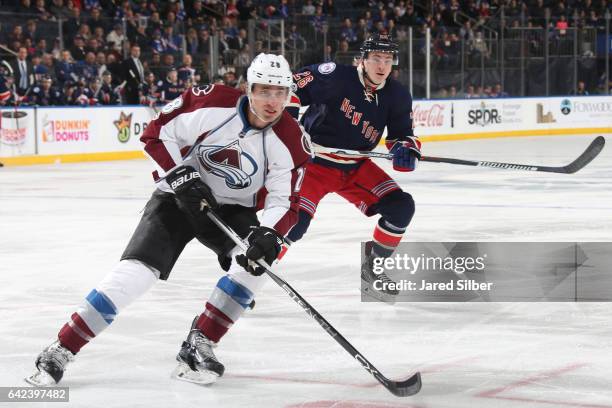 Patrick Wiercioch of the Colorado Avalanche skates against Jimmy Vesey of the New York Rangers at Madison Square Garden on February 11, 2017 in New...