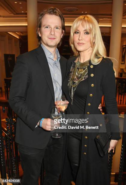 Conrad Baker and Emma Noble attend the Joshua Kane show during the London Fashion Week February 2017 collections at the London Palladium on February...