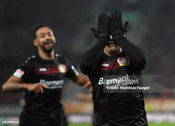 Javier Hernandez of Leverkusen celebrates scoring the second goal with Karim Bellarabi during the Bundesliga match between FC Augsburg and Bayer 04...