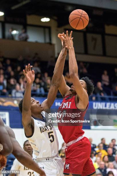Kent State Golden Flashes F Danny Pippen defends the shot attempt of Miami RedHawks F Marcus Weathers first half of the men's college basketball game...