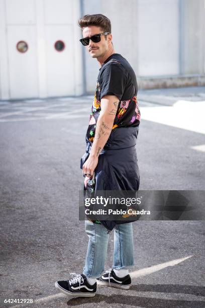 Pelayo Diaz wears Vans trainers, blue jeans and Ray-Ban sunglasses at Ifema during Mercedes Benz Fashion Week Madrid Autumn / Winter 2017 on February...