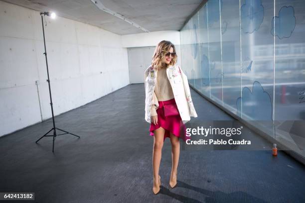 Helena Cuevas wears Mango pullover and shoes, Zara skirt, Asos jacket and Vera Blonde handbag at Ifema on February 17, 2017 in Madrid, Spain.