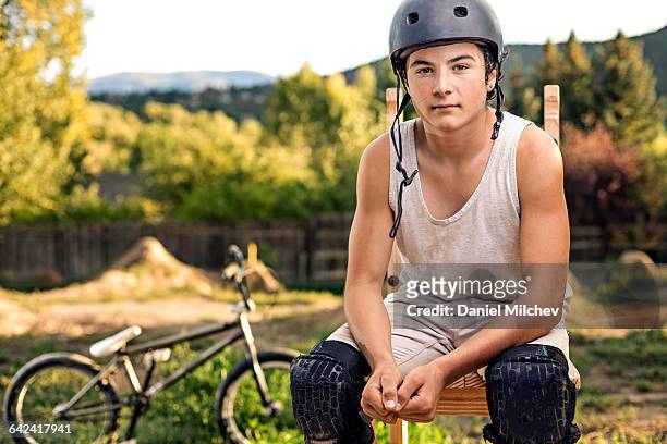 portrait of a teen action sports athlete. - teenager cycling helmet stock pictures, royalty-free photos & images
