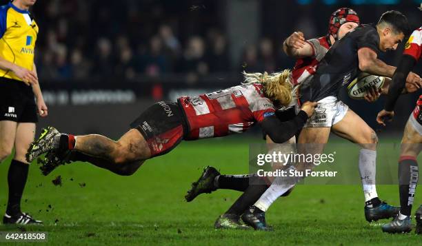 Richard Hibbard of Gloucester hangs onto Saracens flyhalf Alex Lozowski during the Aviva Premiership match between Gloucester Rugby and Saracens at...