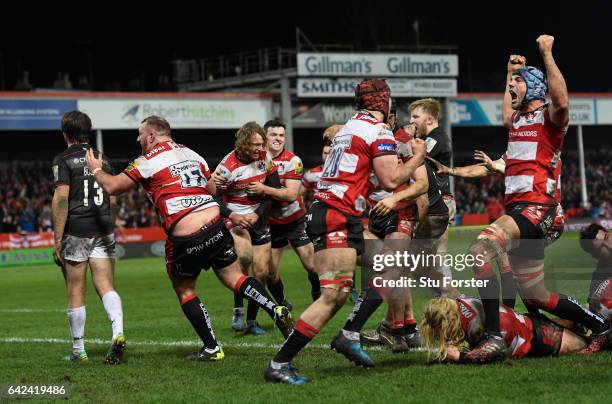 Richard Hibbard of Gloucester goes over to score as his Gloucester team mates celebrate during the Aviva Premiership match between Gloucester Rugby...