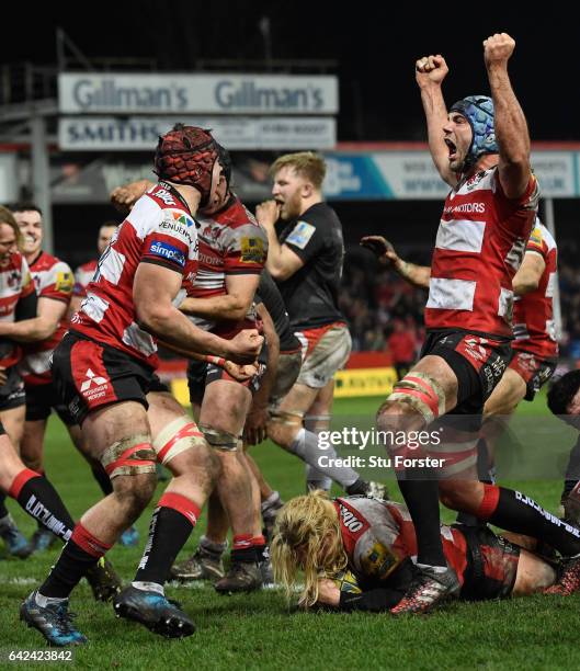 Richard Hibbard of Gloucester goes over to score as his Gloucester team mates celebrate during the Aviva Premiership match between Gloucester Rugby...