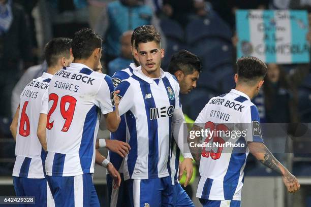 Porto's Portuguese forward Andre Silva celebrates after scoring goal with teammates during the Premier League 2016/17 match between FC Porto and CD...