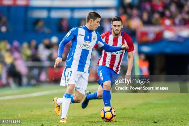 Alexander Szymanowski of Deportivo Leganes is chased by Jorge Resurreccion Merodio, Koke, of Atletico de Madrid during their La Liga match between...