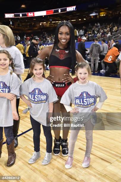Member of the Chicago Luvabulls poses for a photo with young fans before the NBA All-Star Celebrity Game as a part of 2017 All-Star Weekend at the...
