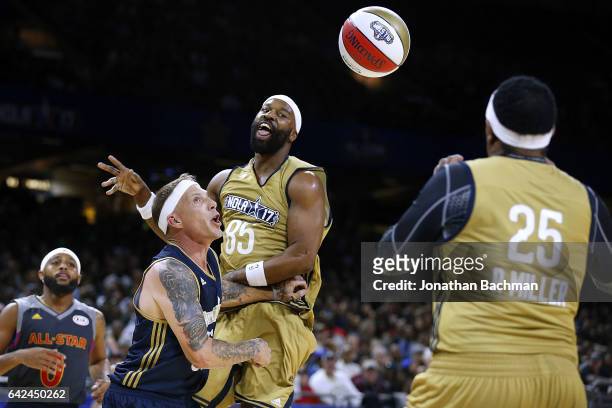 Baron Davis passes around Jason Williams during the NBA All-Star Celebrity Game at the Mercedes-Benz Superdome on February 17, 2017 in New Orleans,...